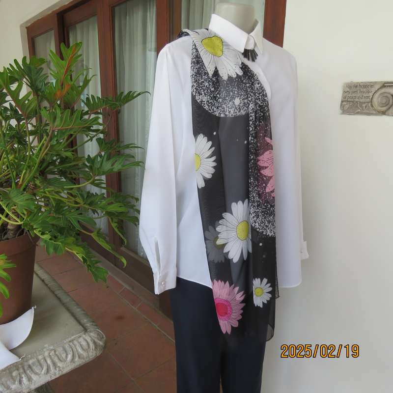 Charming sheer polyester scarf in black-white with bold pink + white daisies. Size 150cm x 48cm. New
