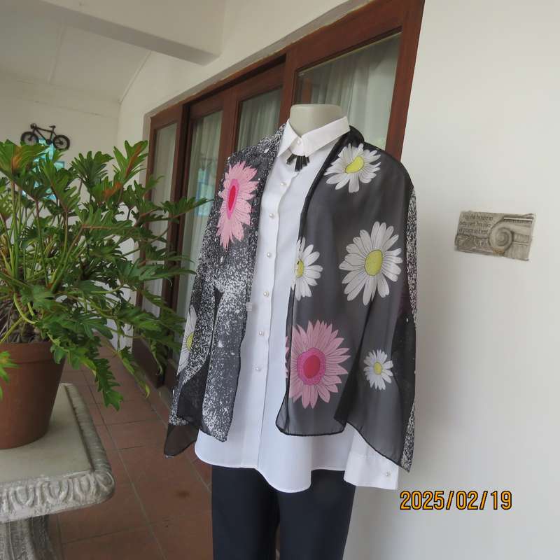 Charming sheer polyester scarf in black-white with bold pink + white daisies. Size 150cm x 48cm. New