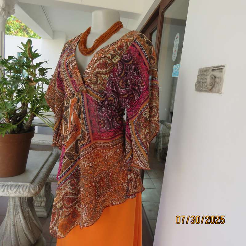 Colourful bo-ho polyester size 34 high-low top with cross over bodice.