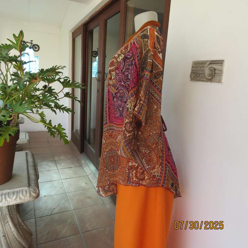 Colourful bo-ho polyester size 34 high-low top with cross over bodice.