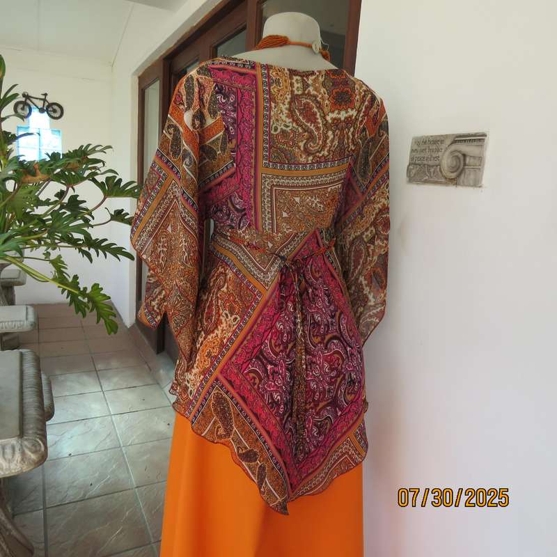 Colourful bo-ho polyester size 34 high-low top with cross over bodice.