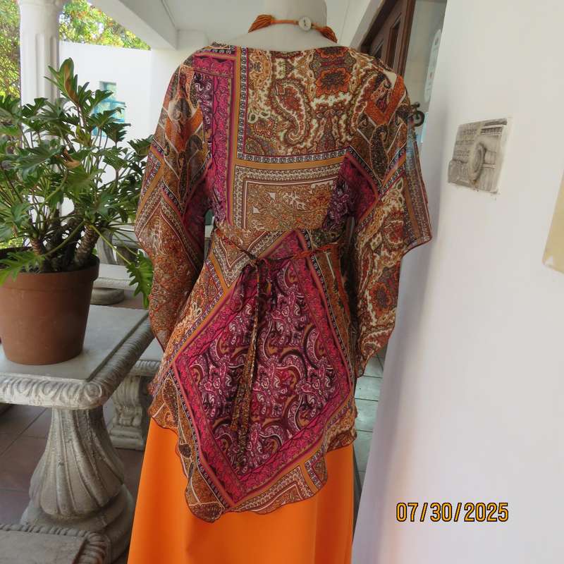 Colourful bo-ho polyester size 34 high-low top with cross over bodice.