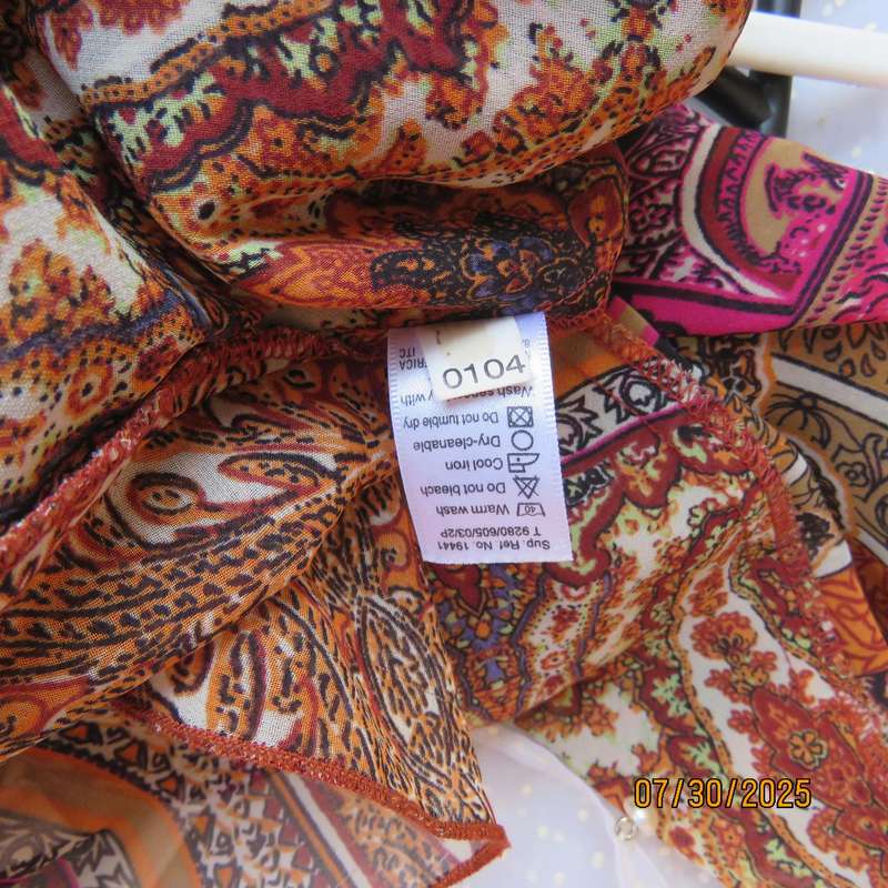 Colourful bo-ho polyester size 34 high-low top with cross over bodice.