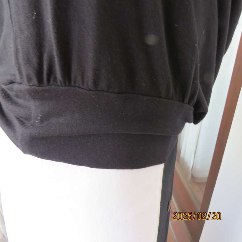 Fabulous GRATITUTE naked shoulder with 3 studded bands black top. Peephole on front. As new cond.