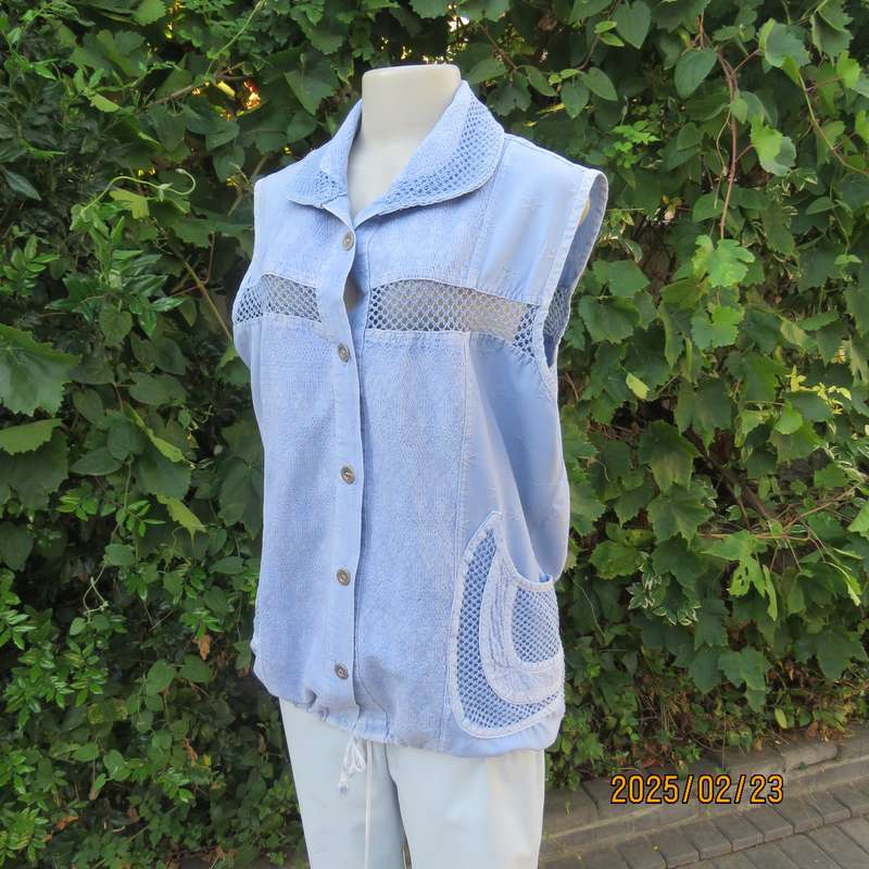 Casual light blue sleeveless cotton button down top. Different fabrics. Size 40. Drawstring hem.