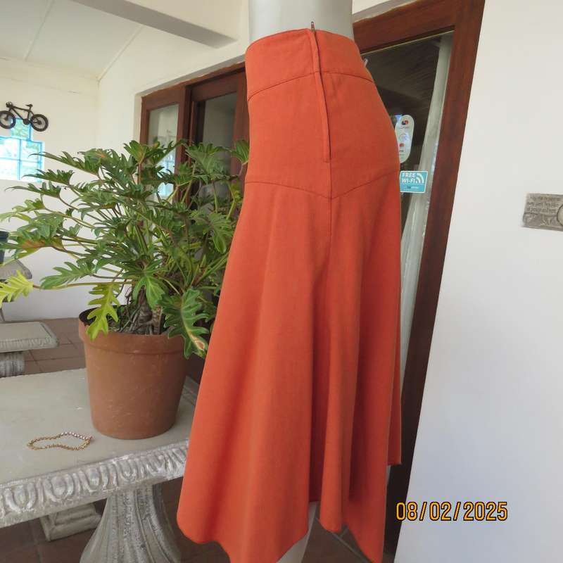 EXACT polyester-rayon high-low burnt orange colour flare skirt. Size 38