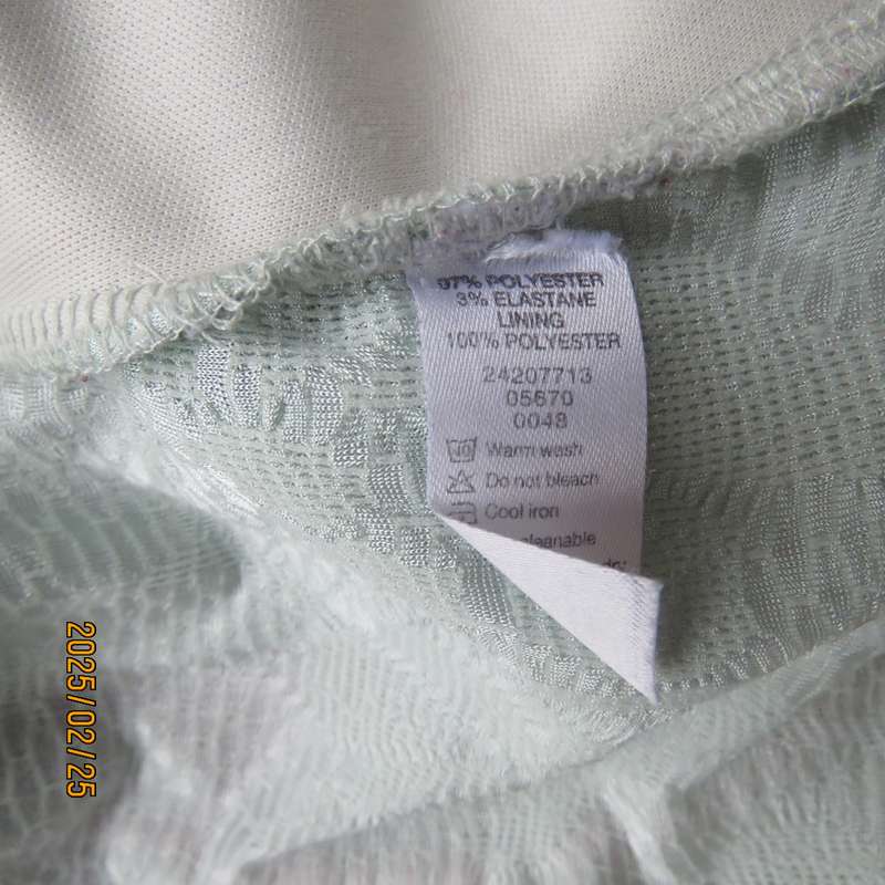 Fabulous pale mint green EXACT size 40 long sleeve slip over top in stretch textured polyester.
