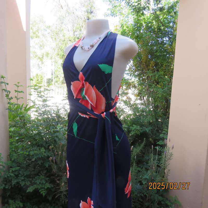 Navy stretch polyester with bold crimson flower pattern tailored fabric with long straps.Size 34-36.