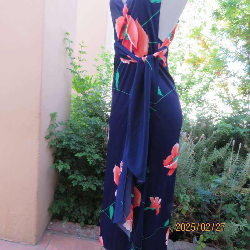 Navy stretch polyester with bold crimson flower pattern tailored fabric with long straps.Size 34-36.