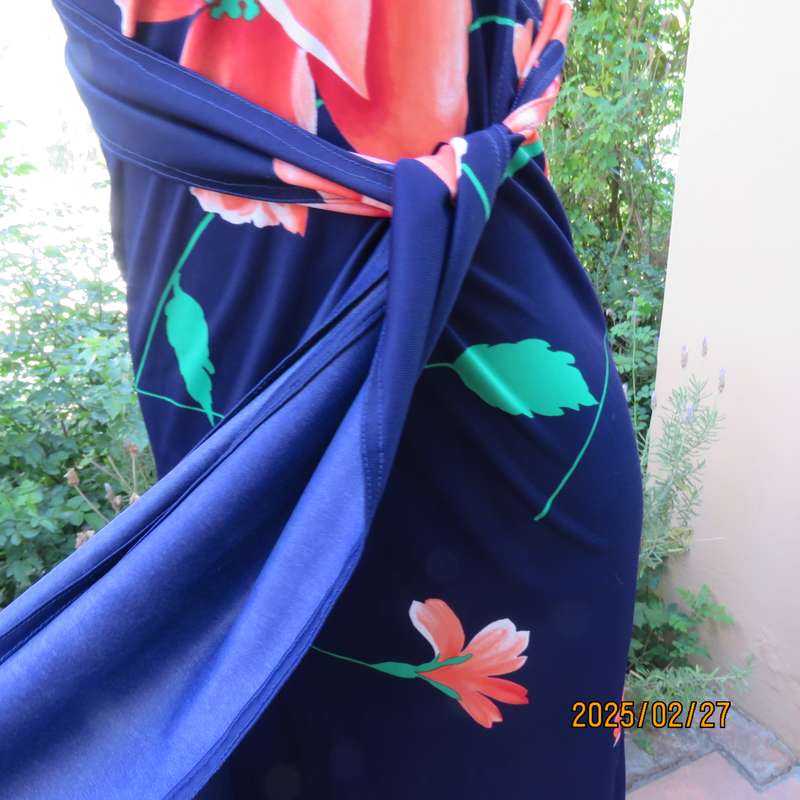 Navy stretch polyester with bold crimson flower pattern tailored fabric with long straps.Size 34-36.