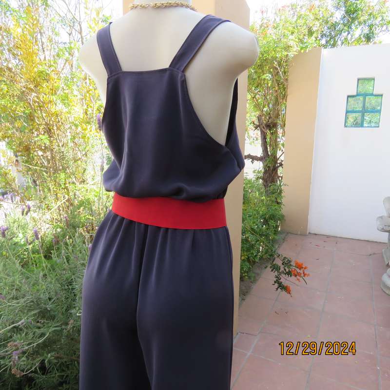 Boutique made dark navy polyester satin like pantsuit size 36. Shoulder straps. As new.