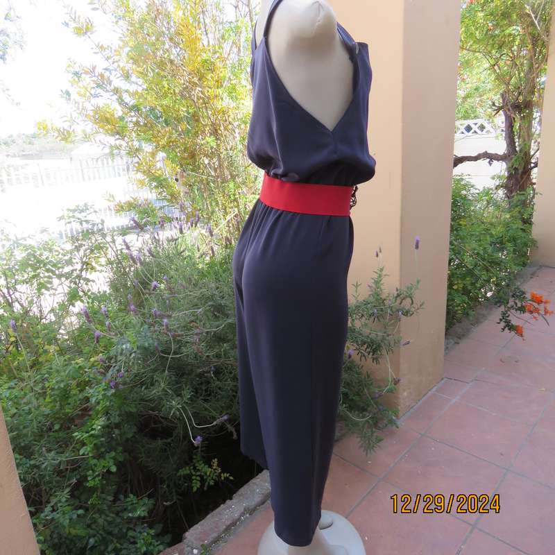 Boutique made dark navy polyester satin like pantsuit size 36. Shoulder straps. As new.