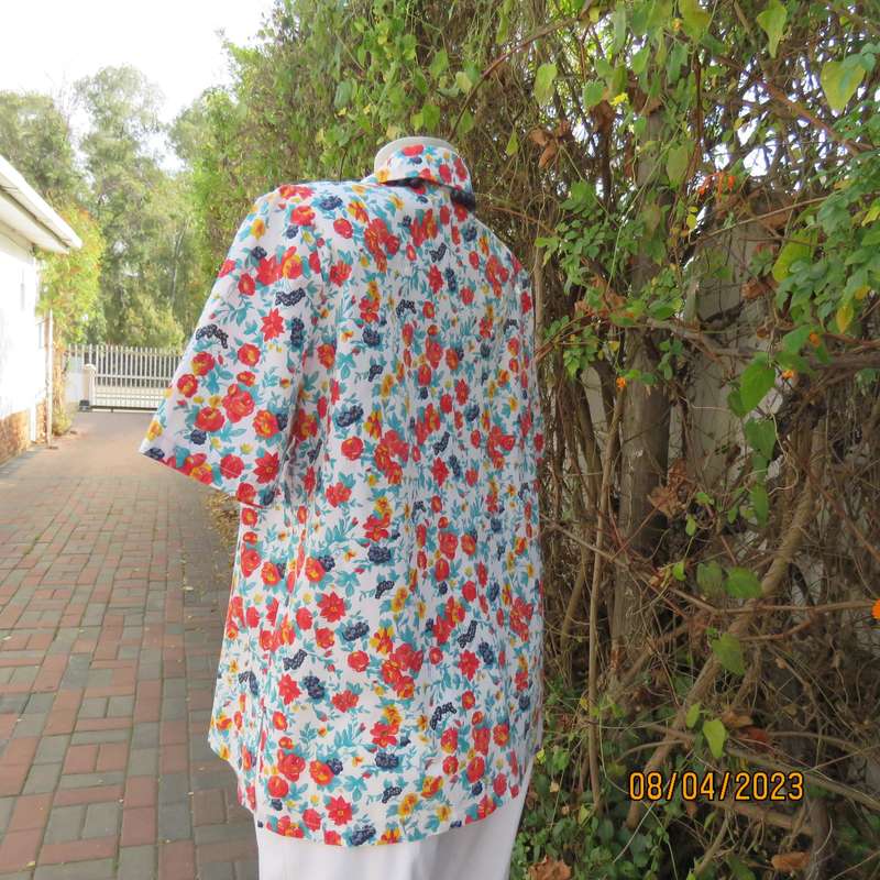 Boutique made white floral button down top in red-blue-yellow. Size 40