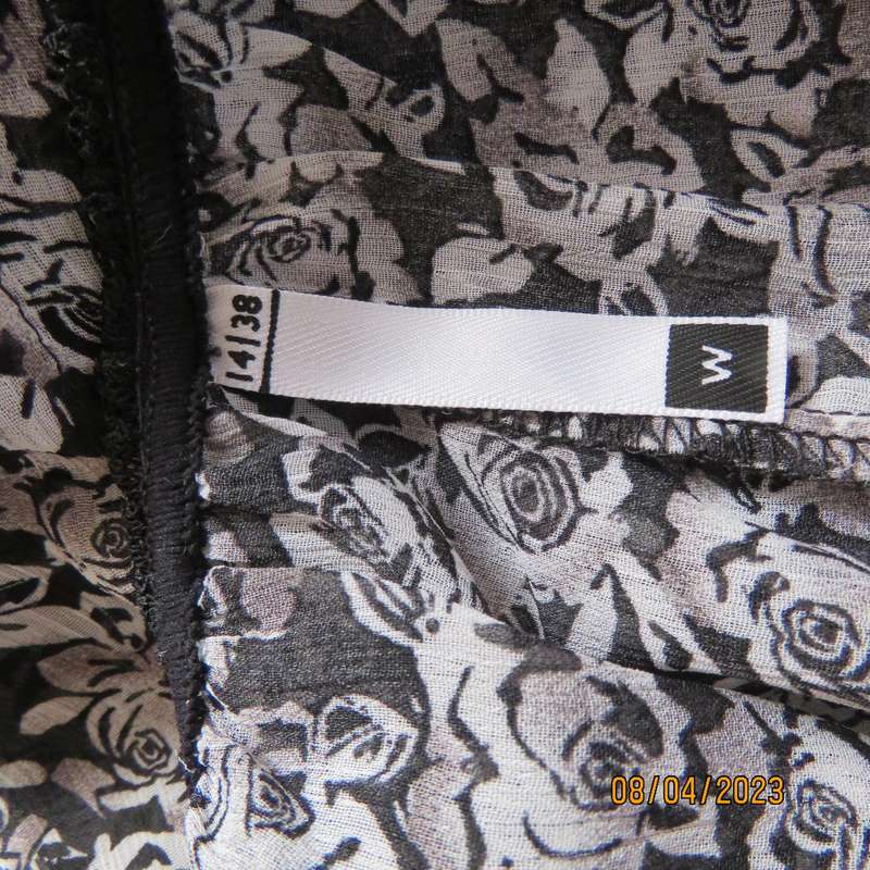 WOOLWORTHS black-white floral sheer polyester top. Wide short cut-on sleeves. Size 38