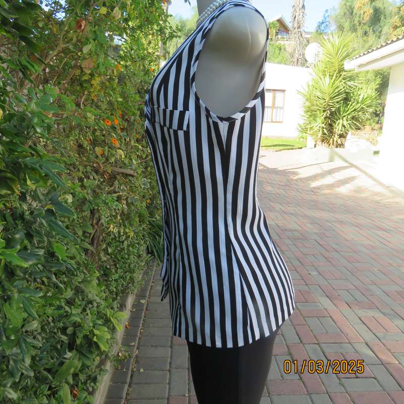 Smart waistcoat style black/white vertical striped crinkled polyester top. Size 38. Double breasted.