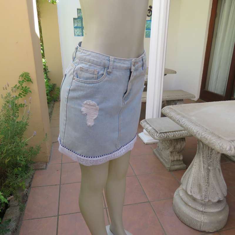 Sexy light blue denim jean distressed look  skirt. Pencil style. Decorative hem. Size 32. As new con