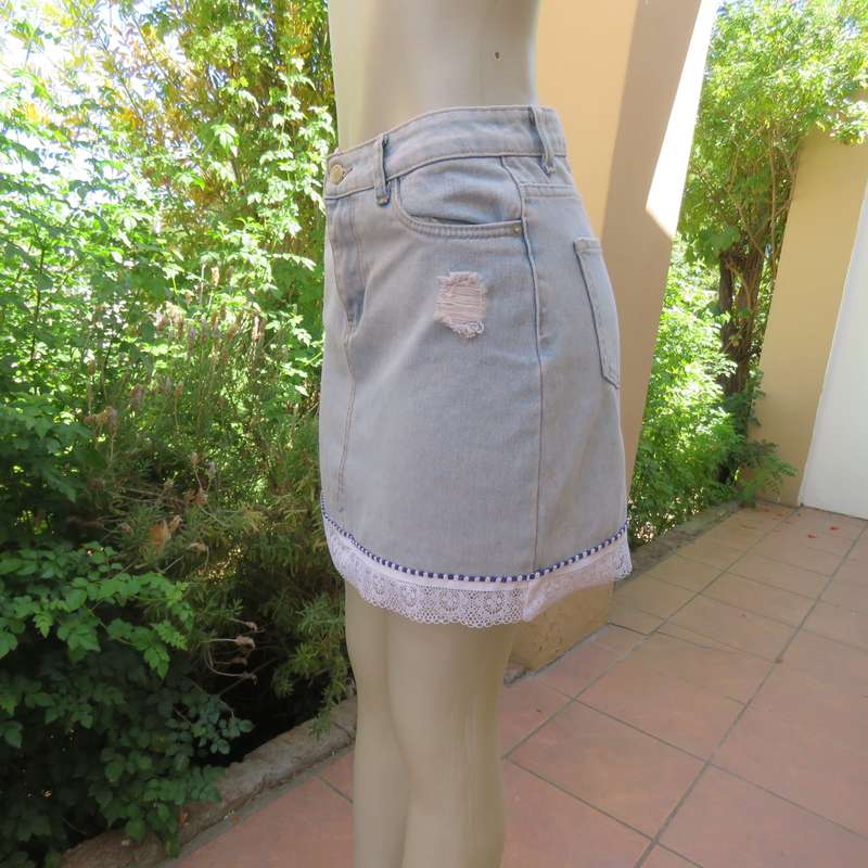 Sexy light blue denim jean distressed look  skirt. Pencil style. Decorative hem. Size 32. As new con