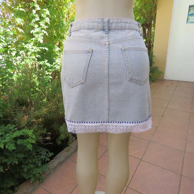 Sexy light blue denim jean distressed look  skirt. Pencil style. Decorative hem. Size 32. As new con