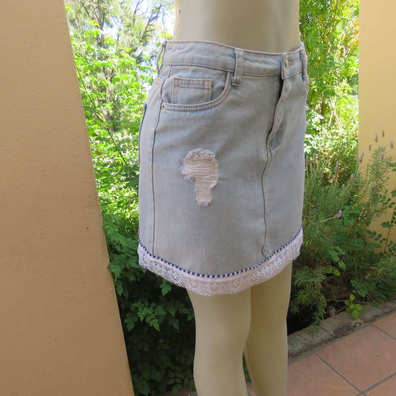 Sexy light blue denim jean distressed look  skirt. Pencil style. Decorative hem. Size 32. As new con