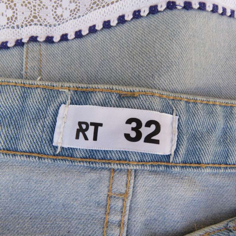 Sexy light blue denim jean distressed look  skirt. Pencil style. Decorative hem. Size 32. As new con