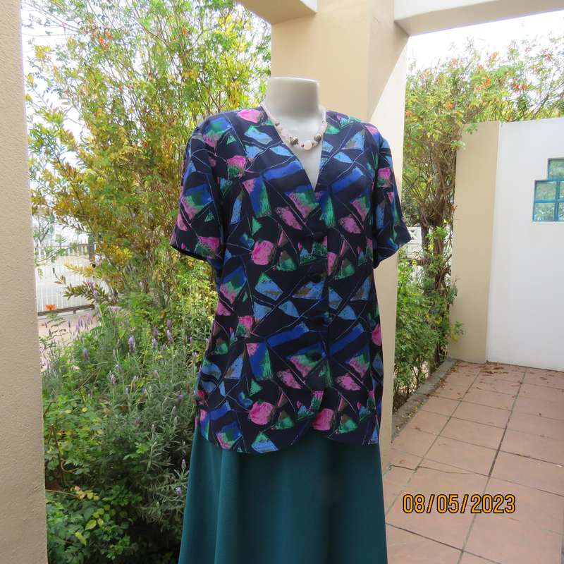 Boutique made navy silky polyester top-short sleeve jacket. Colourful print. Size 40