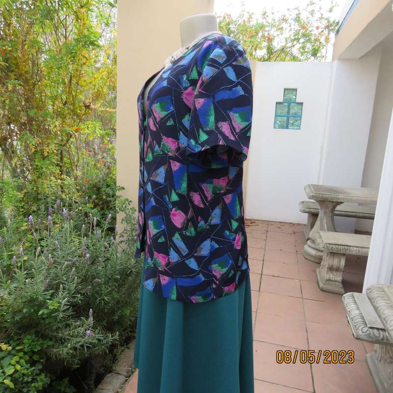 Boutique made navy silky polyester top-short sleeve jacket. Colourful print. Size 40