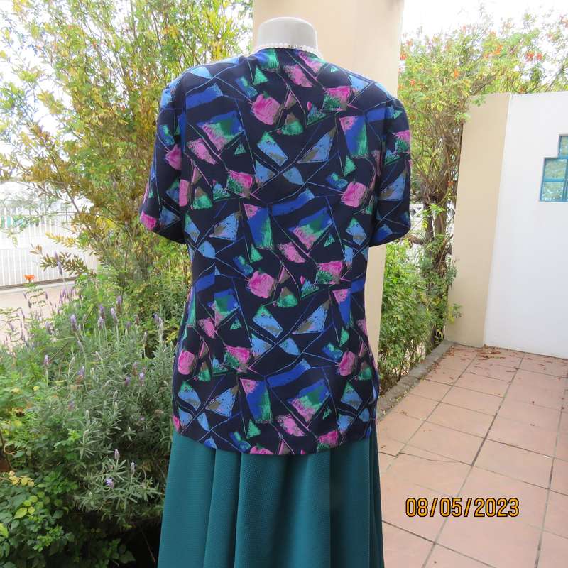 Boutique made navy silky polyester top-short sleeve jacket. Colourful print. Size 40