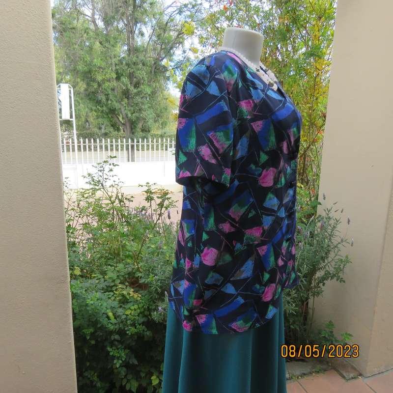 Boutique made navy silky polyester top-short sleeve jacket. Colourful print. Size 40