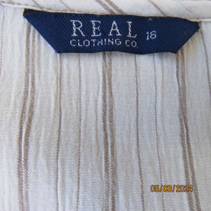 REAL Clothing white poly-rayon creased slip over size 40 top. Dainty floral front embroidery. As new