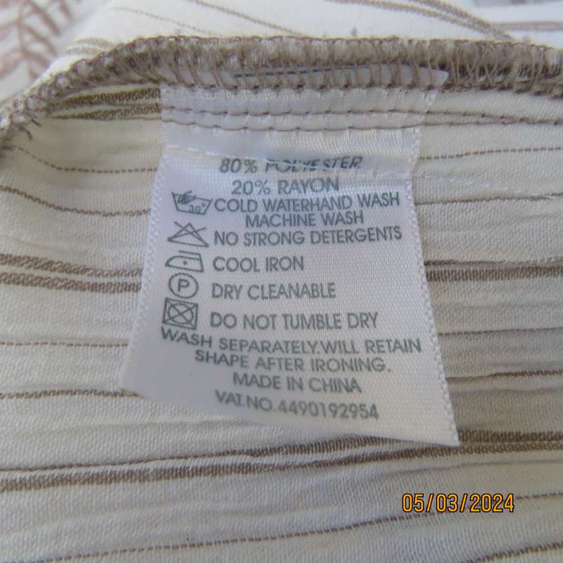 REAL Clothing white poly-rayon creased slip over size 40 top. Dainty floral front embroidery. As new