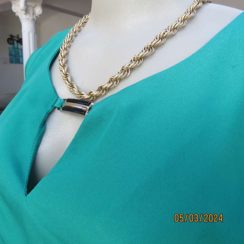FASHION EXPRESS size 46 emerald green slip over sleeveless top. Round neck with short V-buckle