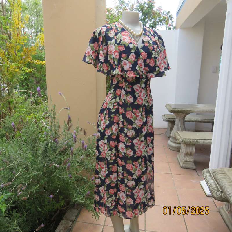 Top of the line sheer polyester navy/crimson/green floral  dress. Amazing wide collar.Size 38.As new
