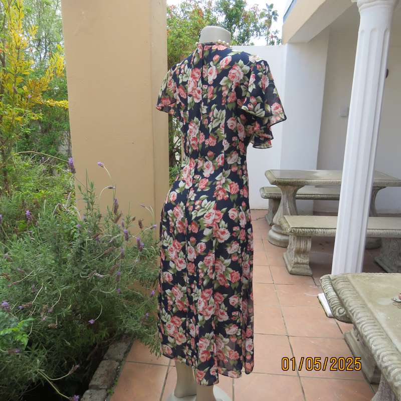 Top of the line sheer polyester navy/crimson/green floral  dress. Amazing wide collar.Size 38.As new