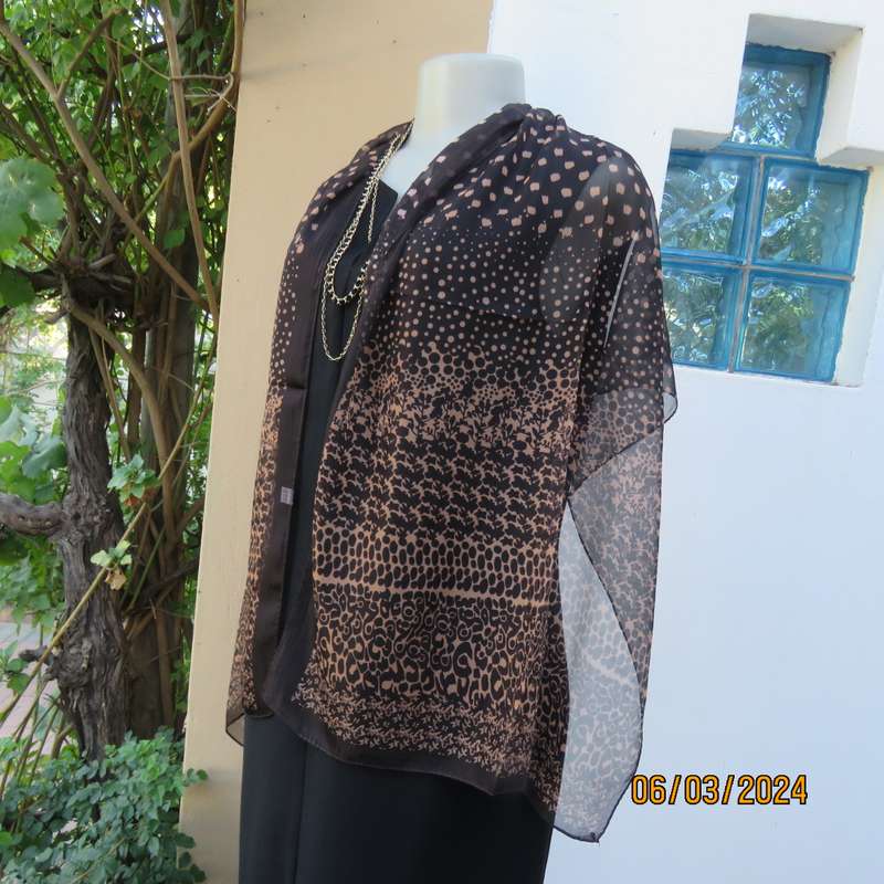 Elegant black sheer polyester scarf with small granola patterns and beautiful borders. 150cm x 50cm.