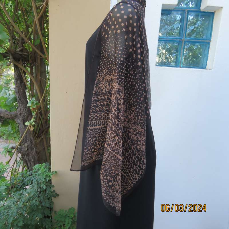 Elegant black sheer polyester scarf with small granola patterns and beautiful borders. 150cm x 50cm.