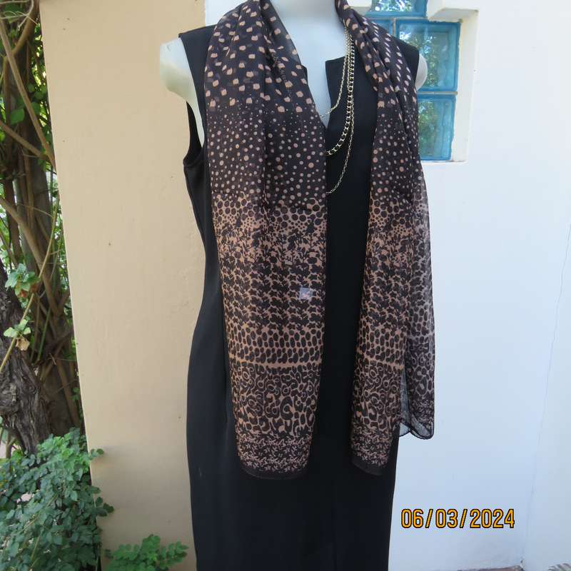Elegant black sheer polyester scarf with small granola patterns and beautiful borders. 150cm x 50cm.