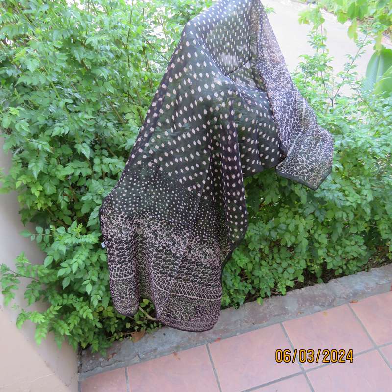 Elegant black sheer polyester scarf with small granola patterns and beautiful borders. 150cm x 50cm.