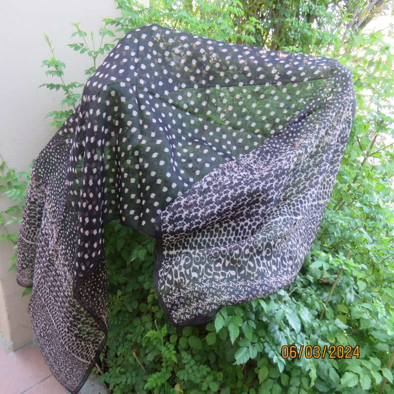 Elegant black sheer polyester scarf with small granola patterns and beautiful borders. 150cm x 50cm.
