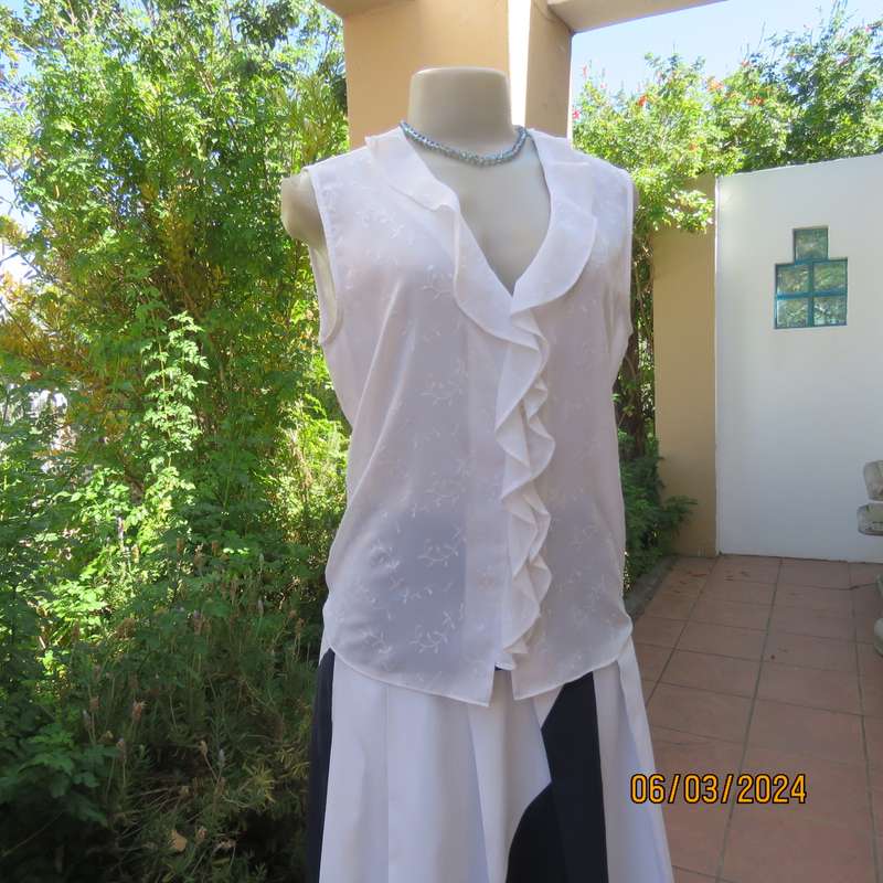 Dainty white sleeveless frilled top in sheer embroidered polyester. Size 36 By WOOLWORTHS.As new.