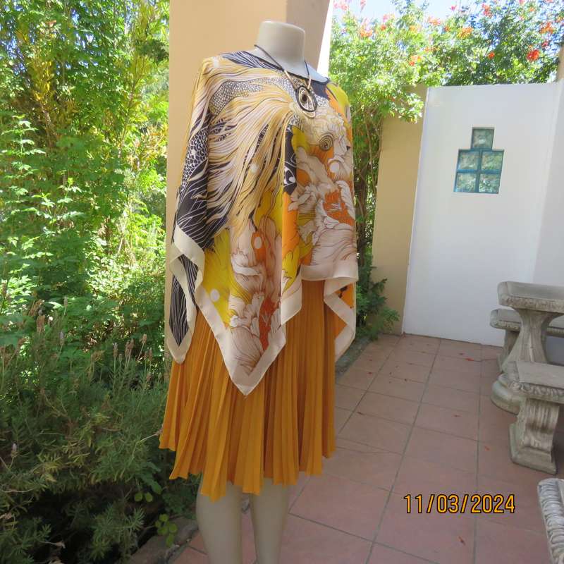 Striking autumn colour throw in silky polyester. Free size. New item