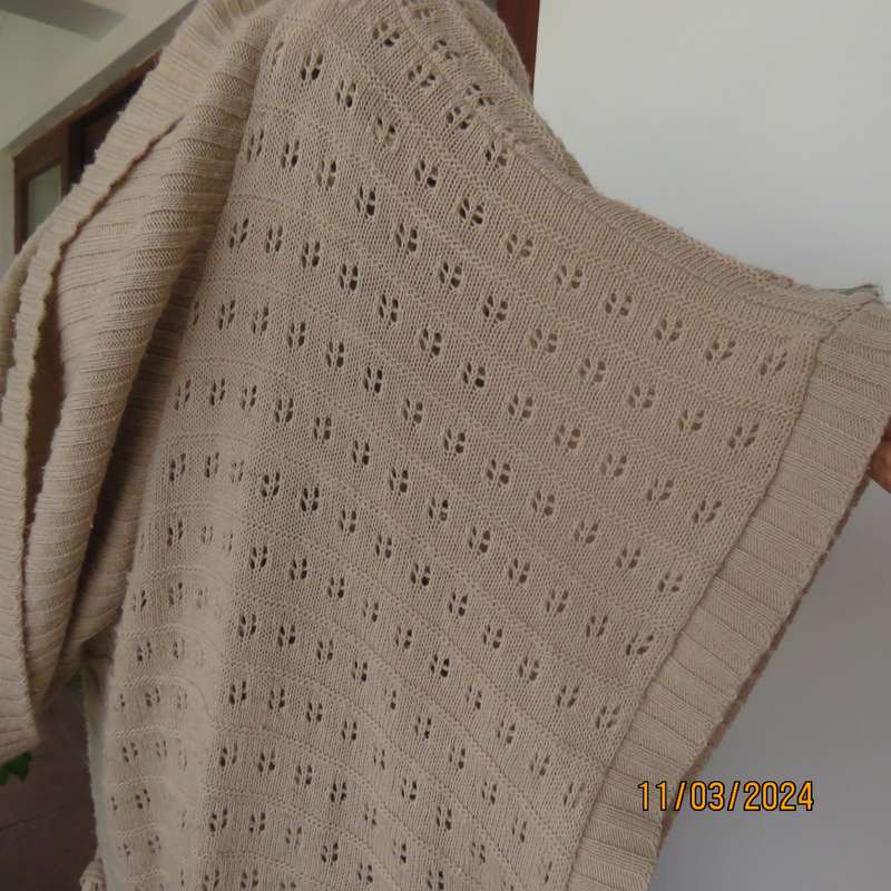 Beige 100% acrylic knit top in lace stitch. Wide open collar. Size 54.
