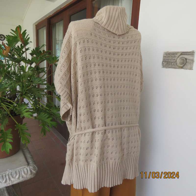 Beige 100% acrylic knit top in lace stitch. Wide open collar. Size 54.