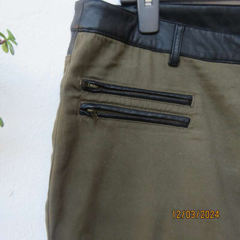KELSO dark olive green skinny pants size 42 with black faux leather waistband.