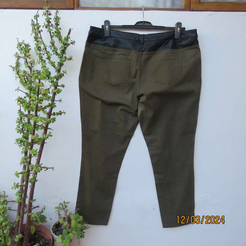 KELSO dark olive green skinny pants size 42 with black faux leather waistband.