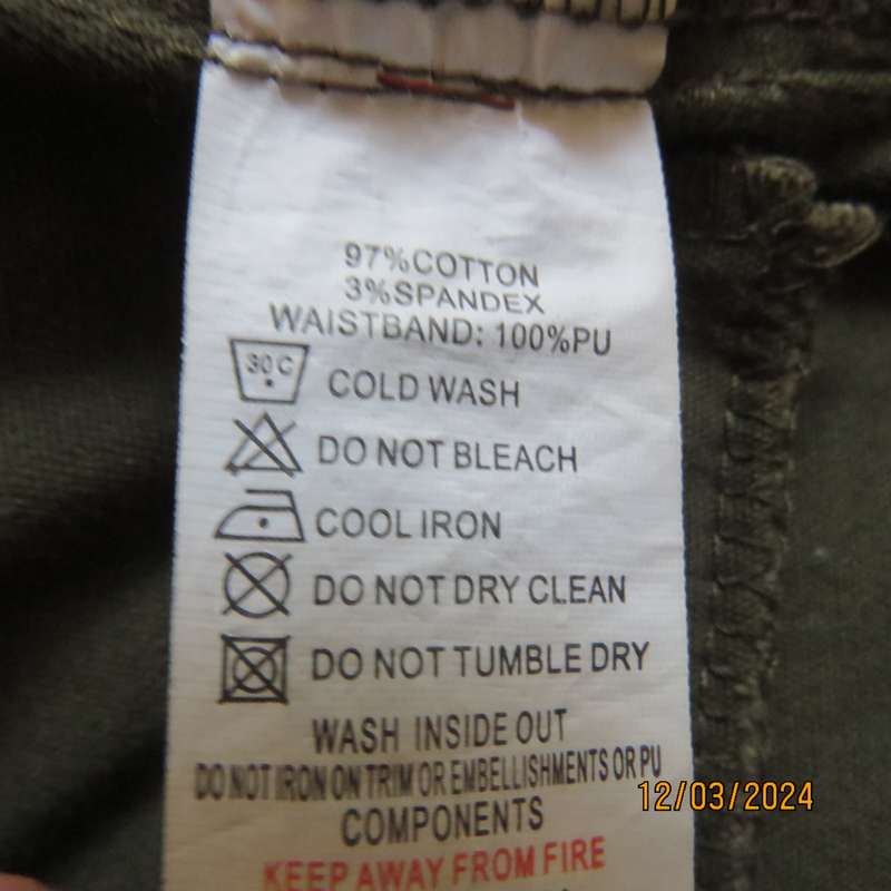 KELSO dark olive green skinny pants size 42 with black faux leather waistband.
