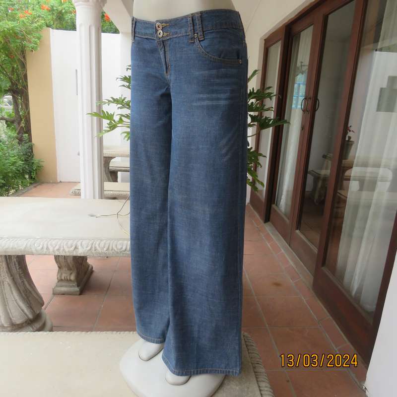 Wide legged blue denim low rise 100% cotton jeans. Size 38. As new.