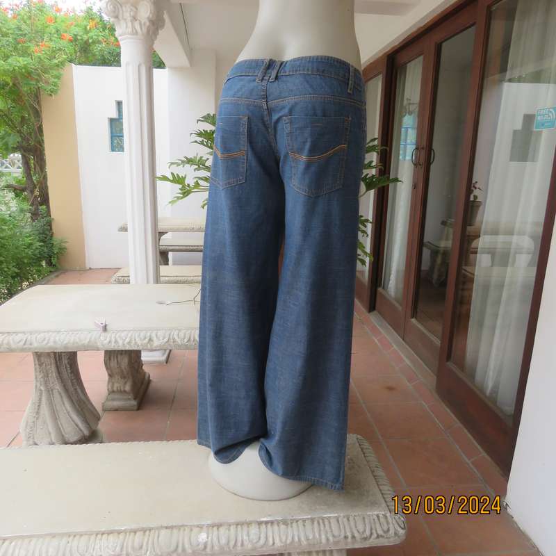 Wide legged blue denim low rise 100% cotton jeans. Size 38. As new.