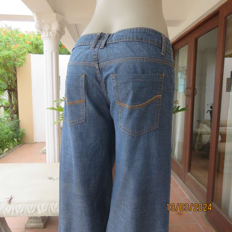 Wide legged blue denim low rise 100% cotton jeans. Size 38. As new.