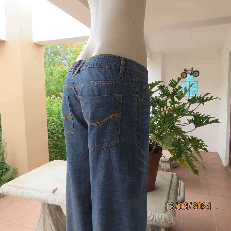 Wide legged blue denim low rise 100% cotton jeans. Size 38. As new.