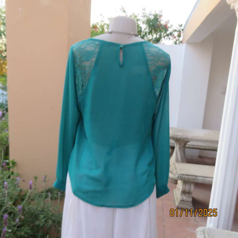 SUPERSTAR jade colour polyester long cuffed sleeve top. With acrylic lace inlays. Size 35-11. As new